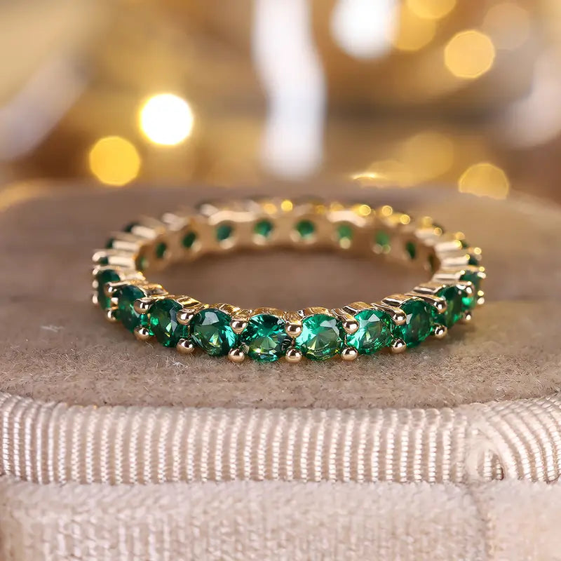 Gouden eternityring met smaragd