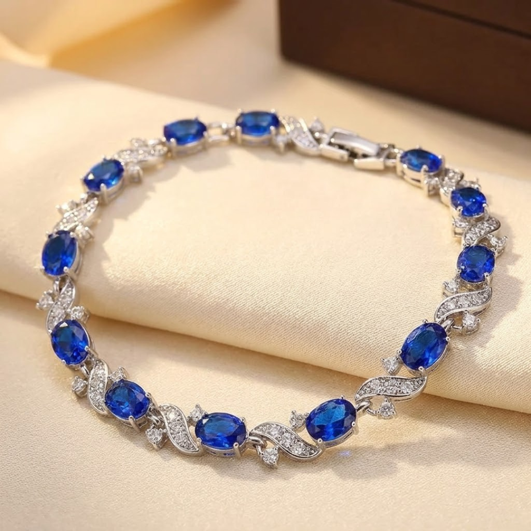 Zilveren bloemen schakelarmband met saffier