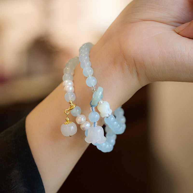 Natuurlijke lelietje-van-dalen pompoen steenarmband met smaragd en jade