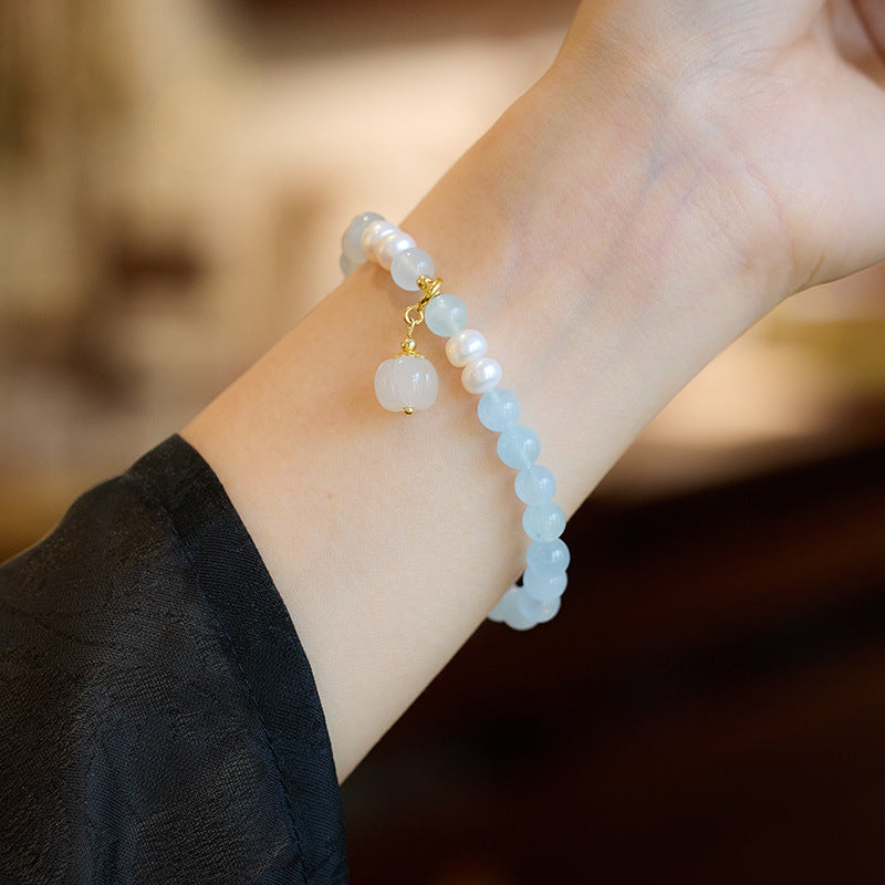 Natuurlijke lelietje-van-dalen pompoen steenarmband met smaragd en jade