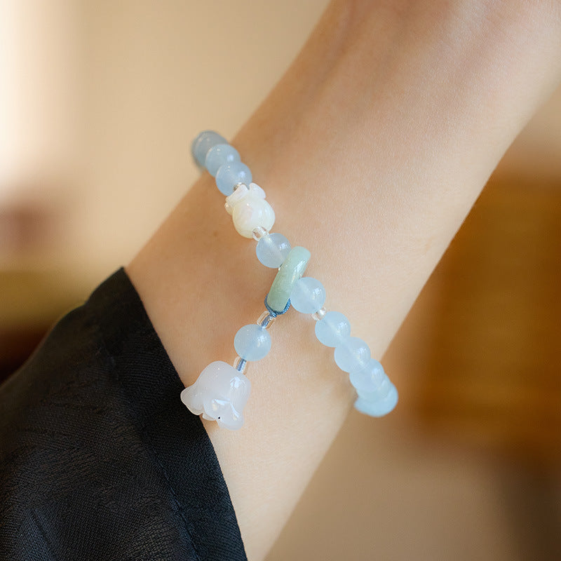 Natuurlijke lelietje-van-dalen pompoen steenarmband met smaragd en jade