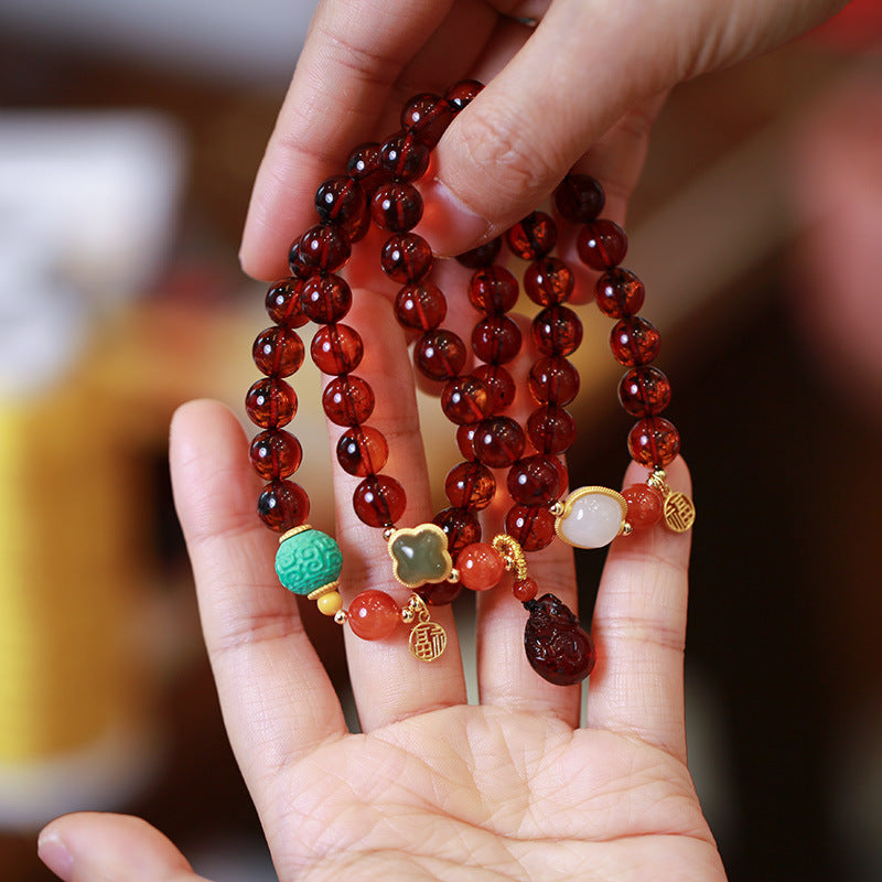 Geluks natuurlijke tasje-armband met bijenwas en barnsteen