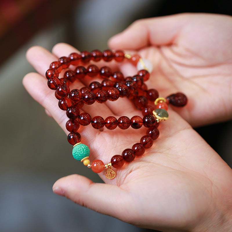 Geluks natuurlijke tasje-armband met bijenwas en barnsteen