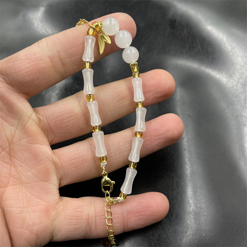 Witte natuurlijke bamboe steenarmband met jade en smaragd