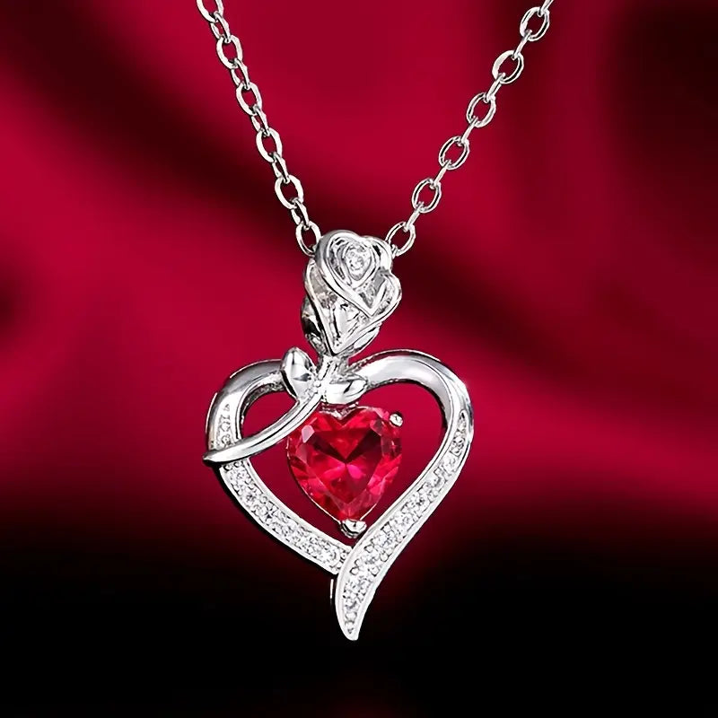 Zilveren harthangerketting met robijn