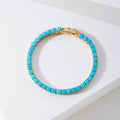 Ronde gouden turkooisarmband met tennis