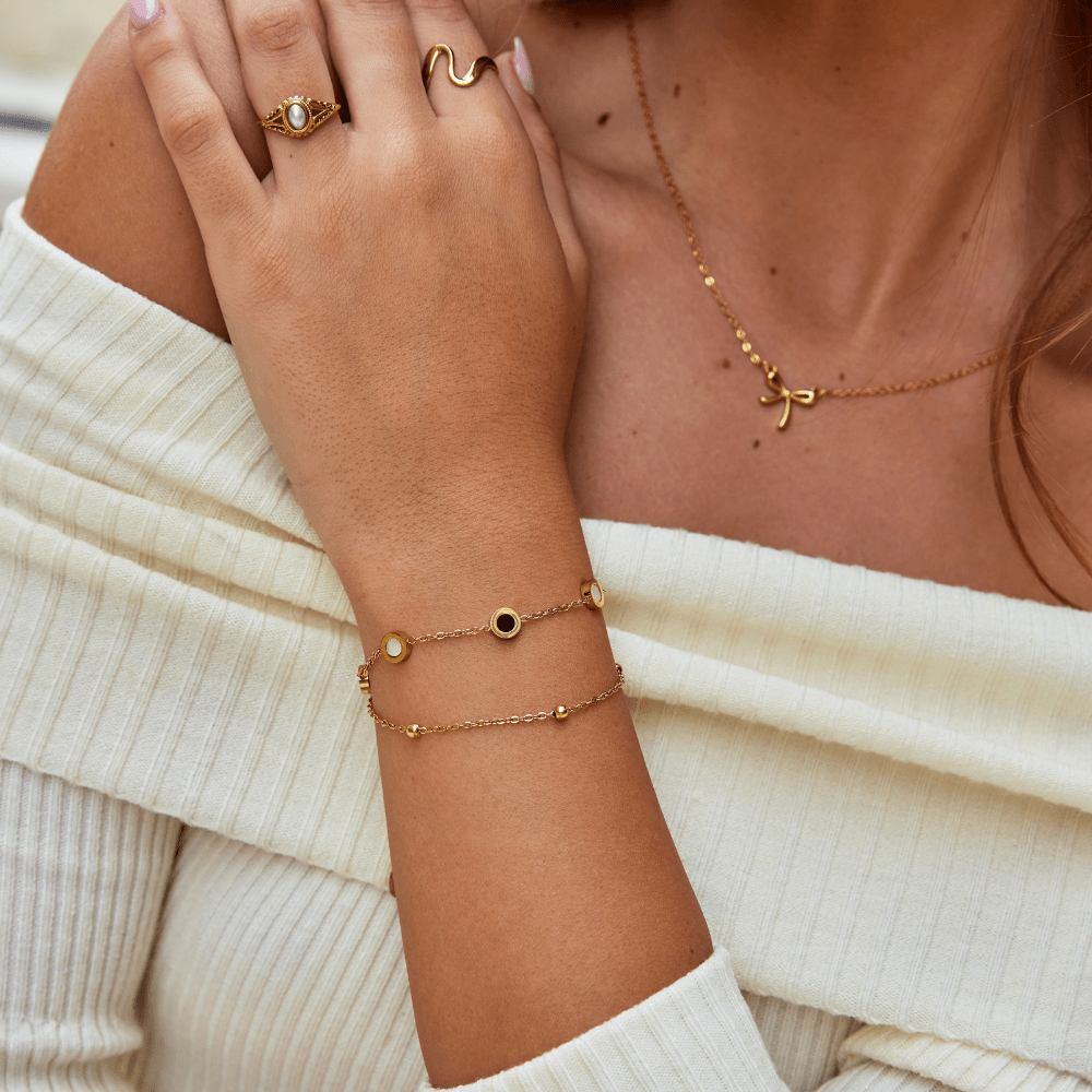 Witte steenarmband met onyx