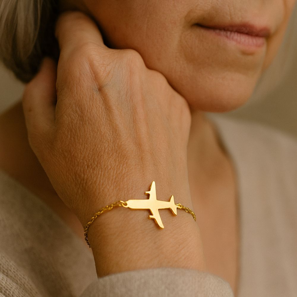 Gouden vliegtuigarmband