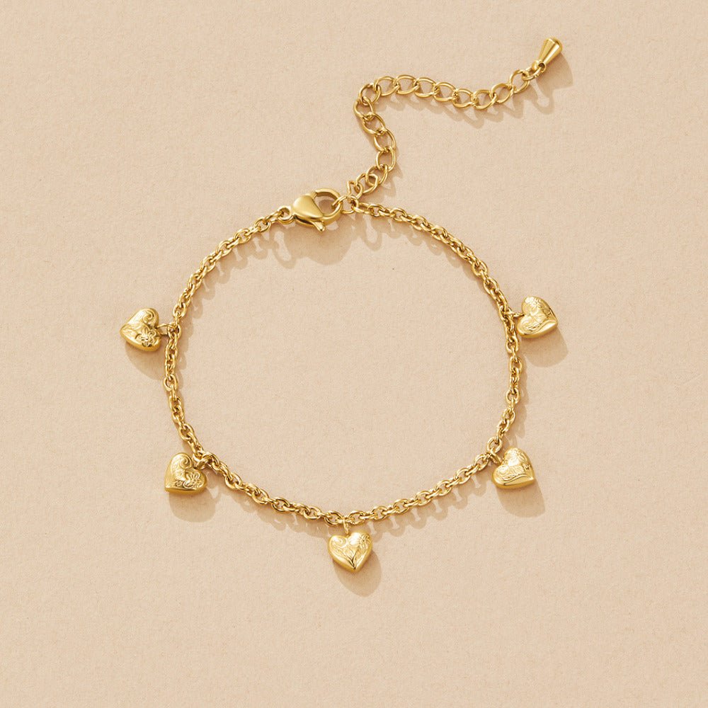 Vintage gouden bedelarmband met hartje